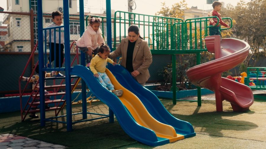The outdoor play structure and slides at Kovida Pre School